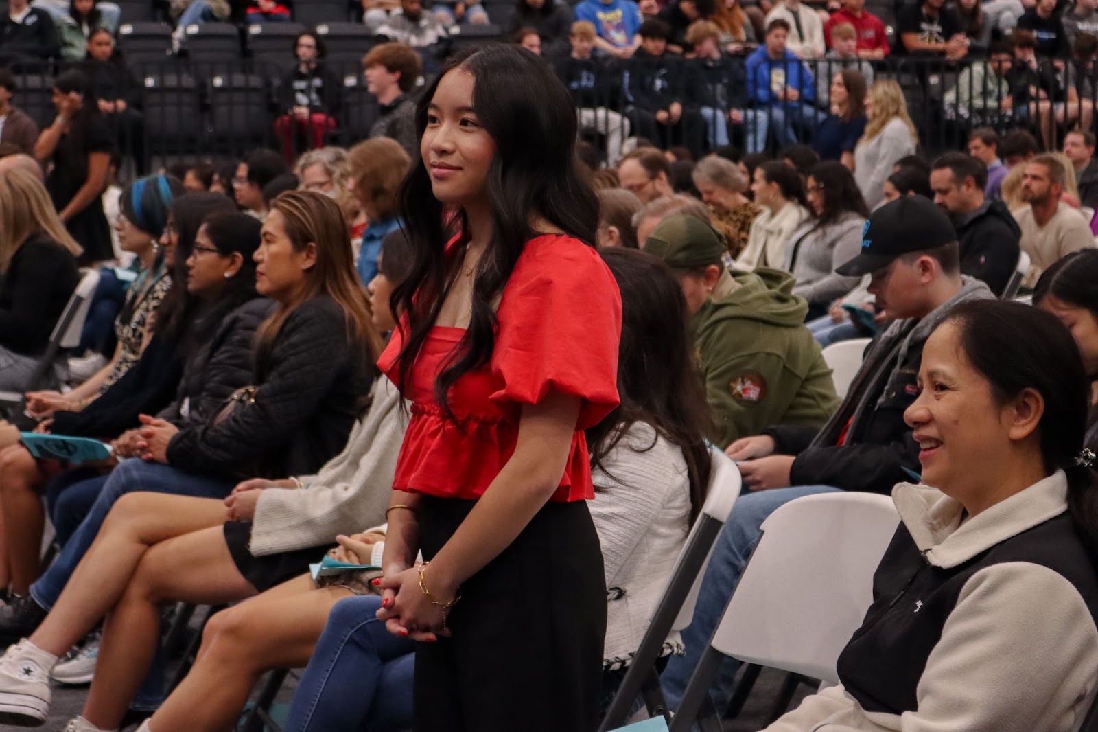 student standing during ceremony